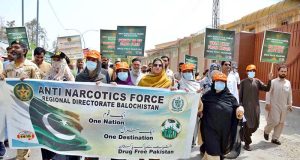 Participants take part in an awareness walk outside the Balochistan Assembly on World Anti-Narcotics Day, organized jointly by the Social Welfare Department and the Anti-Narcotics Force.