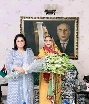 BISP Chairperson Rubina Khalid presents a bouquet to PPP leader and MPA Faryal Talpur.
