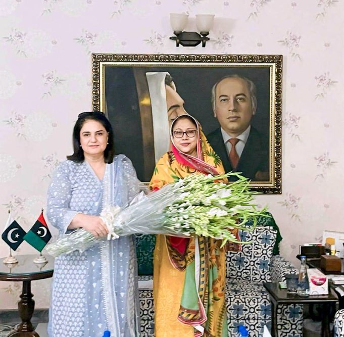 BISP Chairperson Rubina Khalid presents a bouquet to PPP leader and MPA Faryal Talpur.