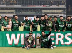 Pakistani players pose with the trophy after winning the three-match T20 International series against Bangladesh at Gaddafi Stadium in Lahore on Sunday, June 1, 2025.