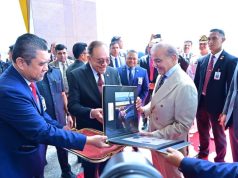 Malaysian Prime Minister Anwar Ibrahim presents photographic album to Prime Minister Shehbaz Sharif capturing highlights of his three-day visit