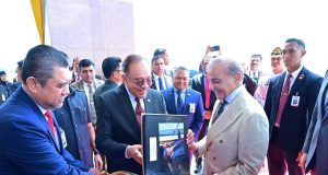 Malaysian Prime Minister Anwar Ibrahim presents photographic album to Prime Minister Shehbaz Sharif capturing highlights of his three-day visit