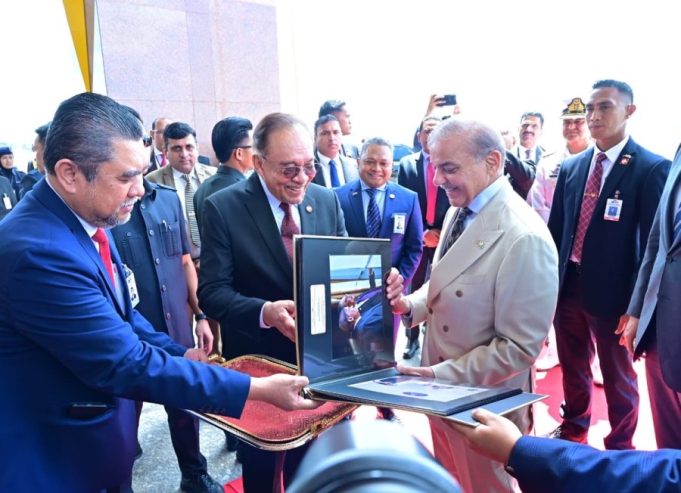 Malaysian Prime Minister Anwar Ibrahim presents photographic album to Prime Minister Shehbaz Sharif capturing highlights of his three-day visit