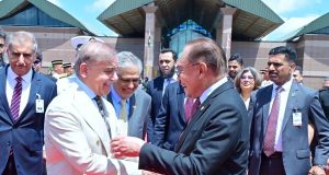 Malaysian Prime Minister Anwar Ibrahim bids farewell to Prime Minister Shehbaz Sharif at Bunga Raya International Airport
