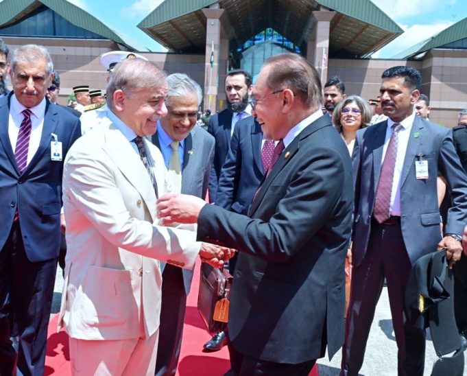 Malaysian Prime Minister Anwar Ibrahim bids farewell to Prime Minister Shehbaz Sharif at Bunga Raya International Airport