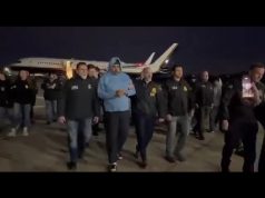 Venezuela’s President Nicolás Maduro being escorted from an aircraft by U.S. authorities in New York.