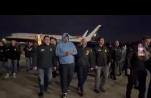 Venezuela’s President Nicolás Maduro being escorted from an aircraft by U.S. authorities in New York.