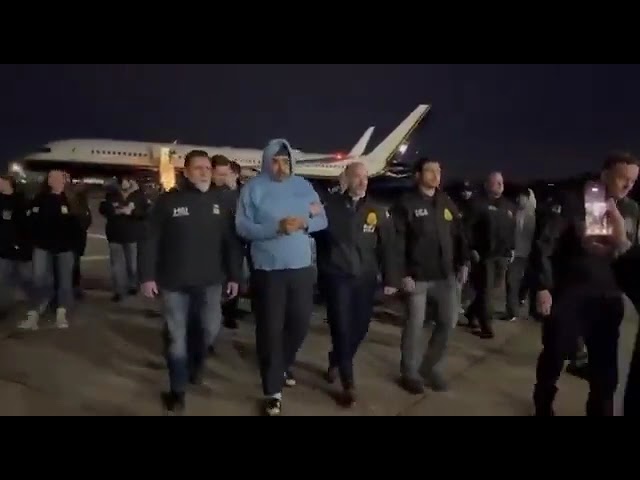 Venezuela’s President Nicolás Maduro being escorted from an aircraft by U.S. authorities in New York.