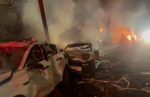 Footage shows the immediate aftermath of an Iranian ballistic missile impact in central Israel, with emergency responders securing the area and assessing damage.