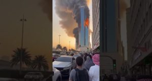 Smoke rises over Bahrain high-rise after Iranian drone strikes in escalating Gulf conflict